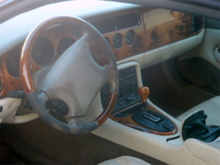 Illustration for article titled Is This Neglected Jaguar XK8 Convertible A Cheap Diamond In The Rough?